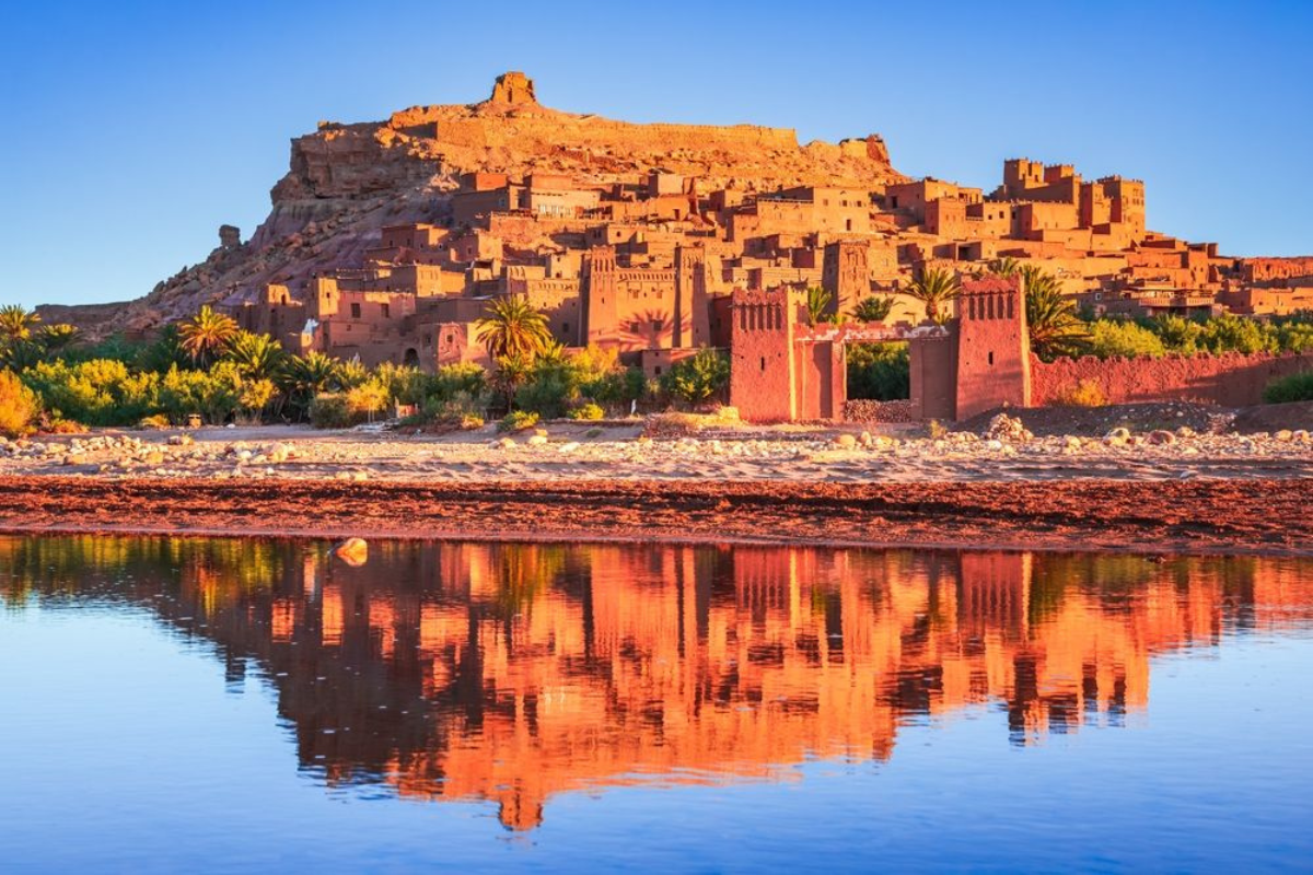 Ait Ben Haddou Kasbah in Morocco reflected in the water