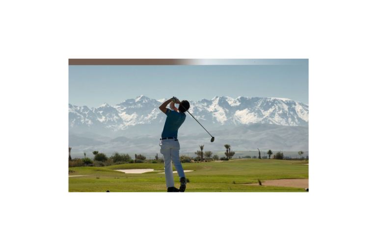 Golfer playing on a golf course with Atlas Mountains in the background